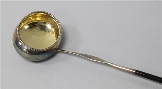 A George III silver toddy ladle with baleen handle, 41cm.